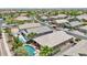 An aerial view of several homes in a residential neighborhood, with one featuring a private pool and lounge area at 19002 N Arbor Dr, Maricopa, AZ 85138