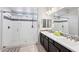 Bathroom with a glass shower and a double sink vanity at 19002 N Arbor Dr, Maricopa, AZ 85138