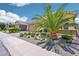 Home featuring a well manicured yard with desert landscaping, a large garage, and a covered porch at 19002 N Arbor Dr, Maricopa, AZ 85138