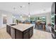 Open-concept living space, chef's kitchen with island, and seamless indoor/outdoor living at 19002 N Arbor Dr, Maricopa, AZ 85138