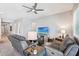 Open living room showcases neutral tones, plush seating, and a large screen TV for relaxation at 19002 N Arbor Dr, Maricopa, AZ 85138