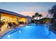 Beautiful backyard with a refreshing pool, covered patio, lounge chairs, and a relaxing outdoor seating area at 19002 N Arbor Dr, Maricopa, AZ 85138