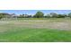 Community soccer field featuring lush green grass, soccer net, and open space for recreation at 19002 N Arbor Dr, Maricopa, AZ 85138