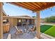 Inviting backyard features a covered patio, artificial turf, and comfortable seating for outdoor enjoyment at 19615 N 18Th Dr, Phoenix, AZ 85027