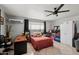 Bedroom features a ceiling fan, desk and an abundance of storage space at 19615 N 18Th Dr, Phoenix, AZ 85027