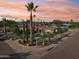 Stunning home with manicured desert landscaping and a circular driveway at sunset at 19615 N 18Th Dr, Phoenix, AZ 85027