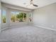 Bright bedroom with large window offering natural light and a beautiful desert view at 21532 N 262Nd Ln, Buckeye, AZ 85396