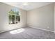 Bedroom with large window and ceiling fan at 21532 N 262Nd Ln, Buckeye, AZ 85396