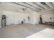 Spacious garage with ample room for parking and storage, featuring a sink and water heater at 21532 N 262Nd Ln, Buckeye, AZ 85396