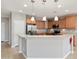 Kitchen features stainless steel appliances, granite countertops, and pendant lighting over the breakfast bar at 21532 N 262Nd Ln, Buckeye, AZ 85396