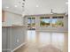 Spacious living room with tile flooring, ceiling fan, and sliding doors that lead to an outdoor patio at 21532 N 262Nd Ln, Buckeye, AZ 85396
