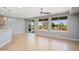 Open living space with views of the backyard through large windows and sliding glass doors for natural light at 21532 N 262Nd Ln, Buckeye, AZ 85396