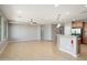 Open-concept living area showcasing tile flooring, recessed lighting, and a breakfast bar overlooking the kitchen at 21532 N 262Nd Ln, Buckeye, AZ 85396
