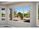 Desert landscaping seen through a bedroom window at 21532 N 262Nd Ln, Buckeye, AZ 85396