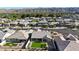 A high-definition aerial view of a well-manicured home with stunning views of a peaceful neighborhood at 2518 E Novak Way, Phoenix, AZ 85042