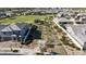 Aerial view of neighborhood homes and a grassy park and playground area at 2518 E Novak Way, Phoenix, AZ 85042