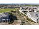 Aerial view of neighborhood homes and a grassy park and playground area at 2518 E Novak Way, Phoenix, AZ 85042