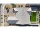 Bird's-eye view of a home's roof, showcasing a well-maintained backyard with a green lawn and desert landscaping at 2518 E Novak Way, Phoenix, AZ 85042