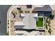 Bird's-eye view of a home's roof, showcasing a well-maintained backyard with a green lawn and desert landscaping at 2518 E Novak Way, Phoenix, AZ 85042