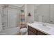 Bathroom features a shower-tub combo, colorful shower curtain, and white counters at 2518 E Novak Way, Phoenix, AZ 85042