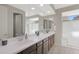 Bathroom has a dual sink vanity and spacious mirror, enhancing the morning routine at 2518 E Novak Way, Phoenix, AZ 85042