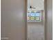 Bedroom showcases natural light, highlighting the inviting atmosphere and window seating at 2518 E Novak Way, Phoenix, AZ 85042