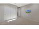 Bedroom offers an entertainment unit and ample closet space, providing convenience and organization at 2518 E Novak Way, Phoenix, AZ 85042