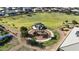 Aerial view of a community park with playground, large green space, and well-maintained landscaping in a neighborhood at 2518 E Novak Way, Phoenix, AZ 85042