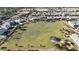 The aerial view showcases a vast, well-manicured community park with a playground and green space for recreation at 2518 E Novak Way, Phoenix, AZ 85042