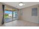 Bright dining area with tile flooring, modern blinds, and a sliding glass door to the outdoor patio at 2518 E Novak Way, Phoenix, AZ 85042