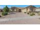 Charming home with a brick paved driveway, stone accents, and manicured landscaping at 2518 E Novak Way, Phoenix, AZ 85042