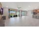 Open-concept living room featuring tile flooring, recessed lighting, and a ceiling fan at 2518 E Novak Way, Phoenix, AZ 85042