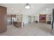 Bright and open living space showcasing tile flooring, recessed lighting, and a modern kitchen at 2518 E Novak Way, Phoenix, AZ 85042