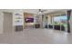 Open living room features a decorative brick wall with shelving and sliding glass doors to the backyard at 2518 E Novak Way, Phoenix, AZ 85042