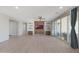 Bright and airy living room with tile flooring, a ceiling fan, and sliding doors to the patio at 2518 E Novak Way, Phoenix, AZ 85042