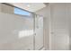 Shower boasts seamless glass enclosure and modern hardware, offering a spa-like experience at 2518 E Novak Way, Phoenix, AZ 85042