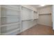 Spacious walk-in closet featuring custom shelving and ample hanging space for organized storage at 2518 E Novak Way, Phoenix, AZ 85042