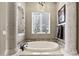 Bathroom featuring a walk-in shower, tub, and granite countertops at 27421 N 22Nd Ln, Phoenix, AZ 85085