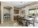 Dining area featuring a sliding glass door leading to the pool and outdoor living area at 27421 N 22Nd Ln, Phoenix, AZ 85085