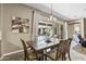 This dining room features a sliding glass door leading to the outdoor living area at 27421 N 22Nd Ln, Phoenix, AZ 85085