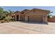 Charming home featuring a three-car garage, desert landscaping, and a stone-accented entry at 27421 N 22Nd Ln, Phoenix, AZ 85085