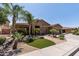 Charming home featuring a three-car garage, desert landscaping, and a stone-accented entry at 27421 N 22Nd Ln, Phoenix, AZ 85085