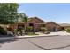 Charming home featuring a three-car garage, desert landscaping, and a stone-accented entry at 27421 N 22Nd Ln, Phoenix, AZ 85085