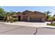 Charming home featuring a three-car garage, desert landscaping, and a stone-accented entry at 27421 N 22Nd Ln, Phoenix, AZ 85085