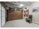 Garage features storage cabinets, epoxy floor, organized space, and stylish accents at 27421 N 22Nd Ln, Phoenix, AZ 85085