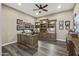 Spacious home office with custom built-ins and wood flooring at 27421 N 22Nd Ln, Phoenix, AZ 85085