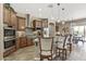 This spacious kitchen features a large island, granite countertops, and stainless steel appliances at 27421 N 22Nd Ln, Phoenix, AZ 85085