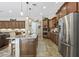 Gourmet kitchen features a large island, stainless steel appliances, and custom cabinetry at 27421 N 22Nd Ln, Phoenix, AZ 85085