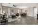 Spacious living room and dining area featuring tile floors and recessed lighting at 27421 N 22Nd Ln, Phoenix, AZ 85085