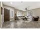 Inviting living room featuring neutral tones, plantation shutters, and stylish furnishings at 27421 N 22Nd Ln, Phoenix, AZ 85085